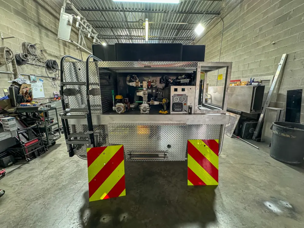 Apparatus in production bay with hood open, photo 121 of 303.